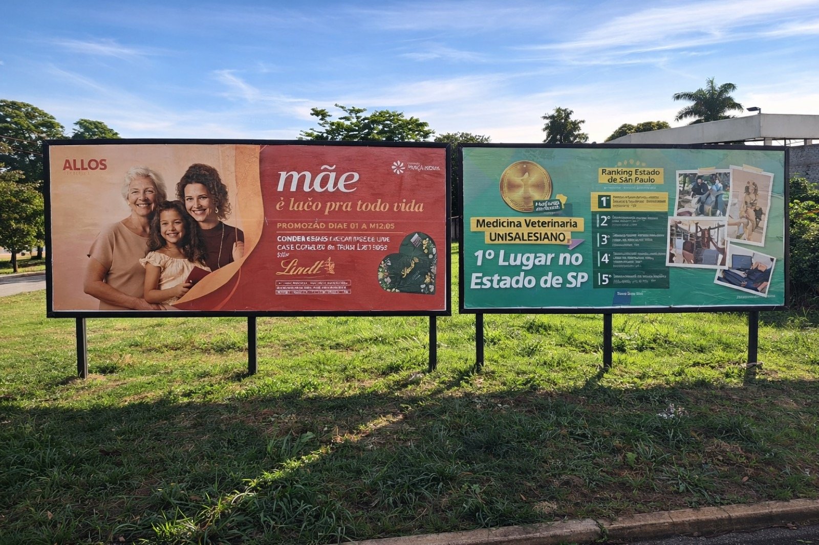 Par de outdoors 9x3 (Allos/Lindt + UniSalesiano) na Av. José Ferreira Baptista esquina com Dona Amélia, Araçatuba
